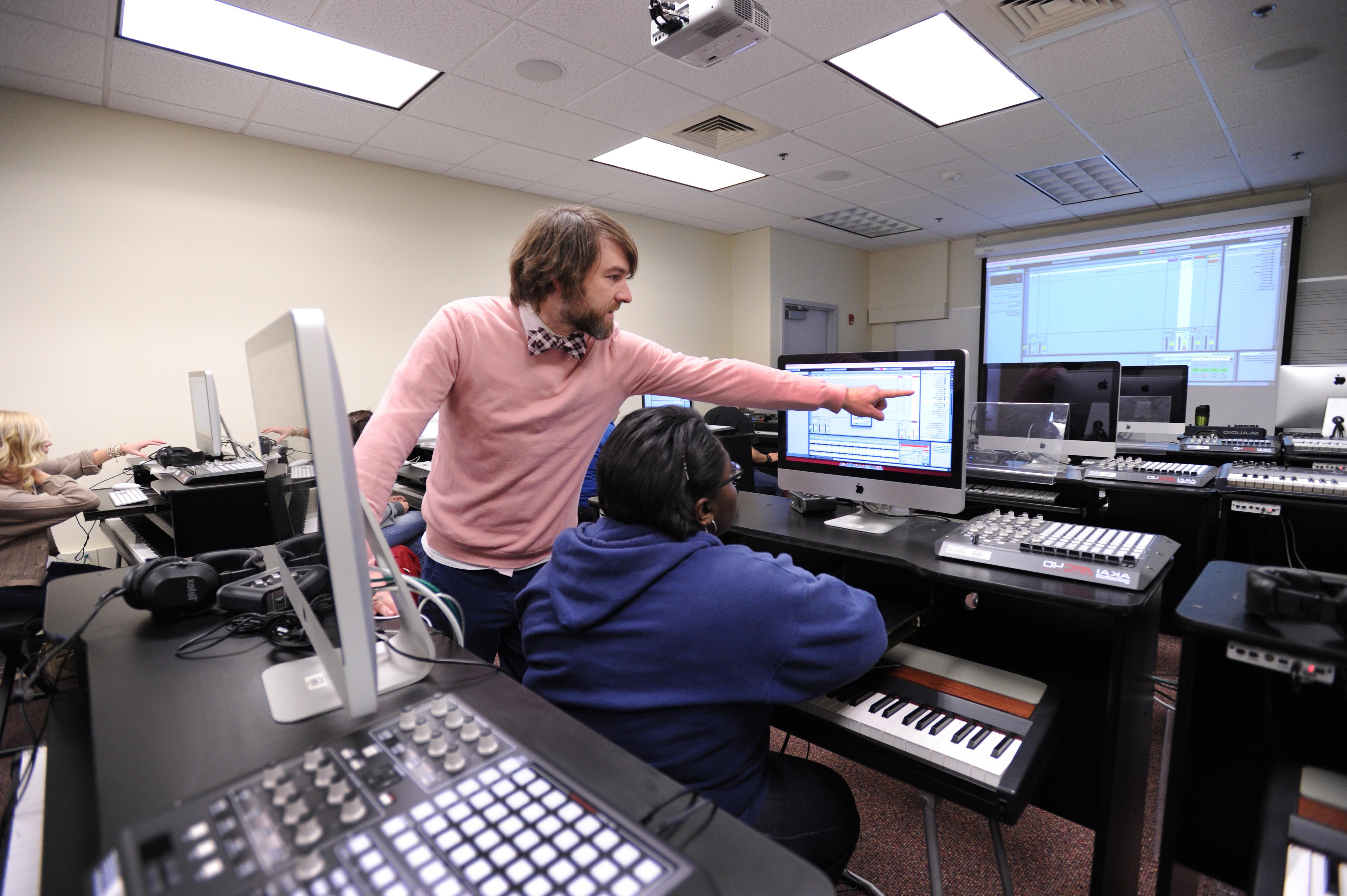 Professor points to computer of student