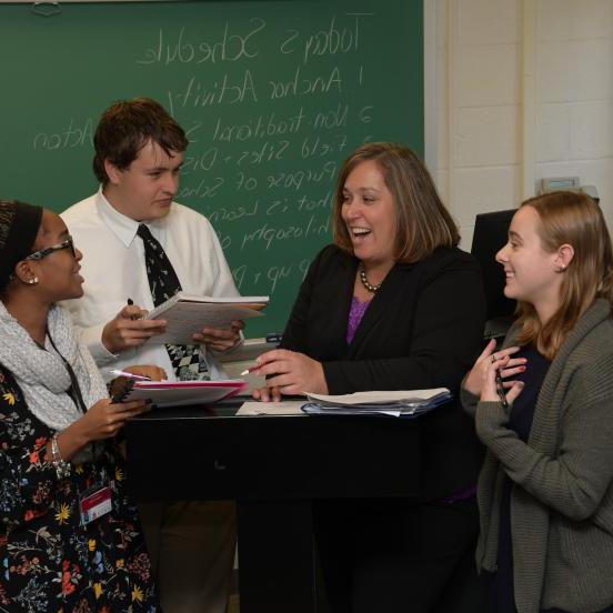 Professor Tracey Garrett speaks with education students