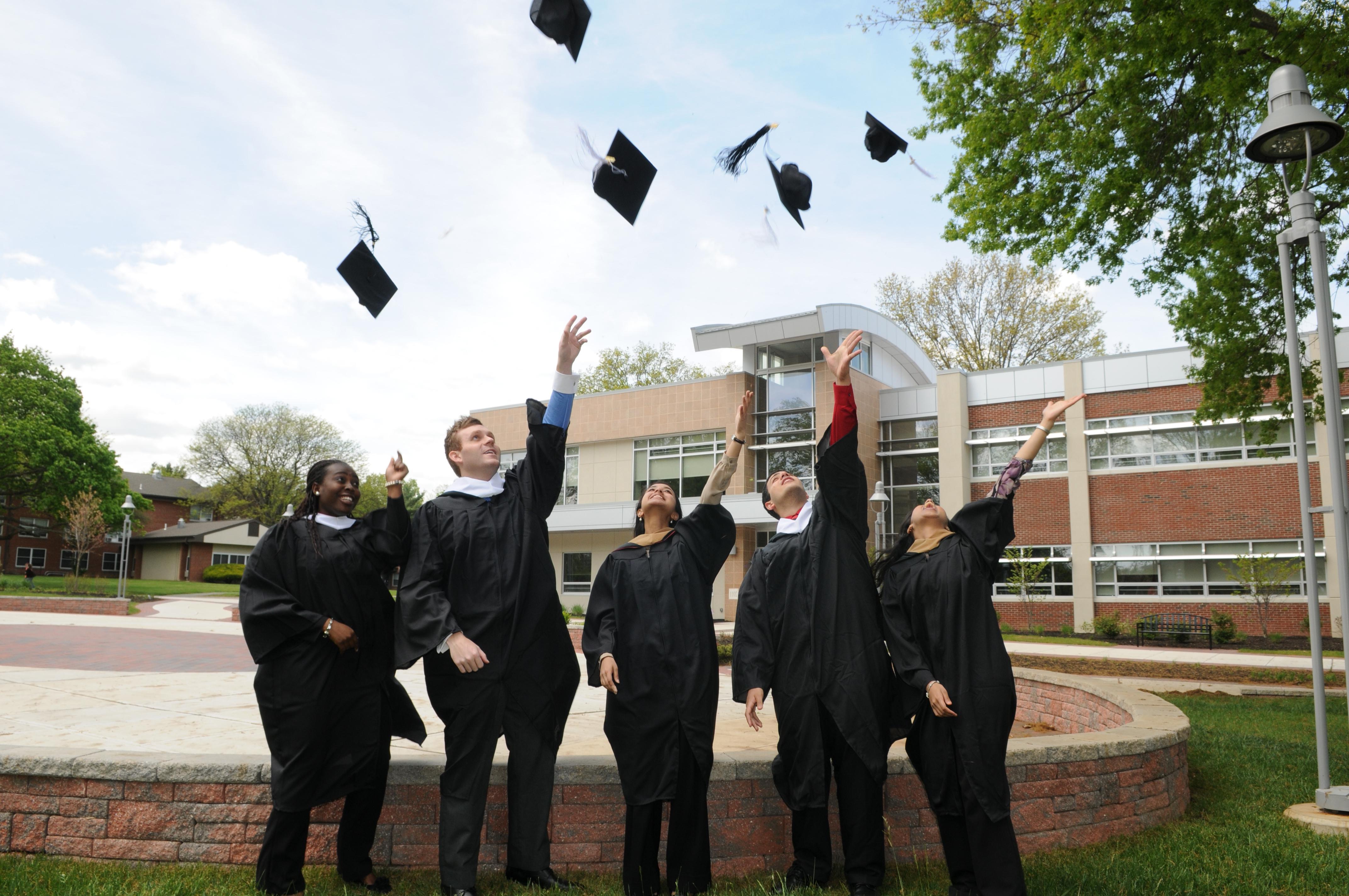 Rider graduates toss their caps at commencement